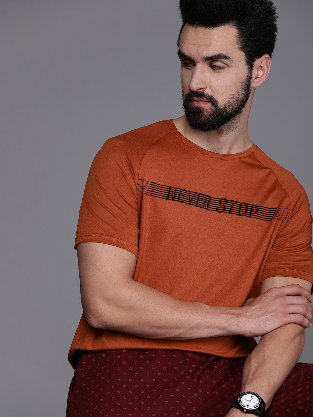 

Louis Philippe ATHPLAY Men Rust Typography Printed Slim Fit T-shirt