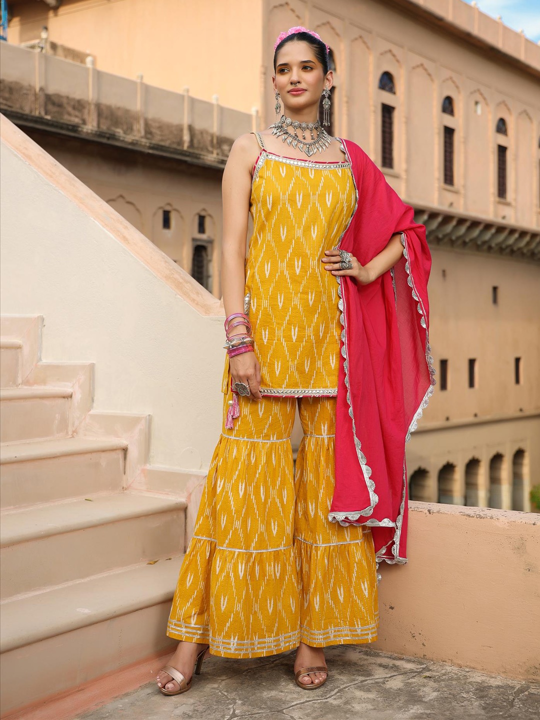 

SCAKHI Women Yellow Printed Gotta Patti Kurti with Sharara & With Dupatta Set