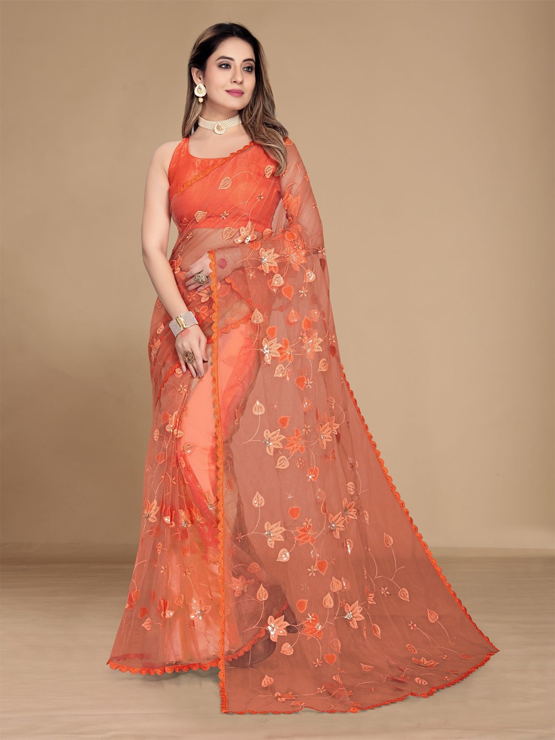 

VAIRAGEE Orange Floral Sequinned Net Saree