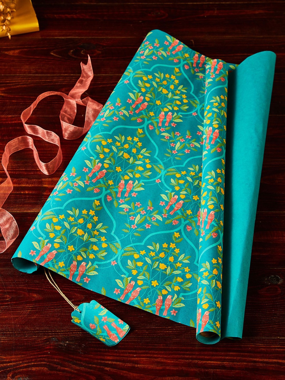 

Home Centre Teal Green Printed Gift Wrapping Sheet with Tag and Ribbon