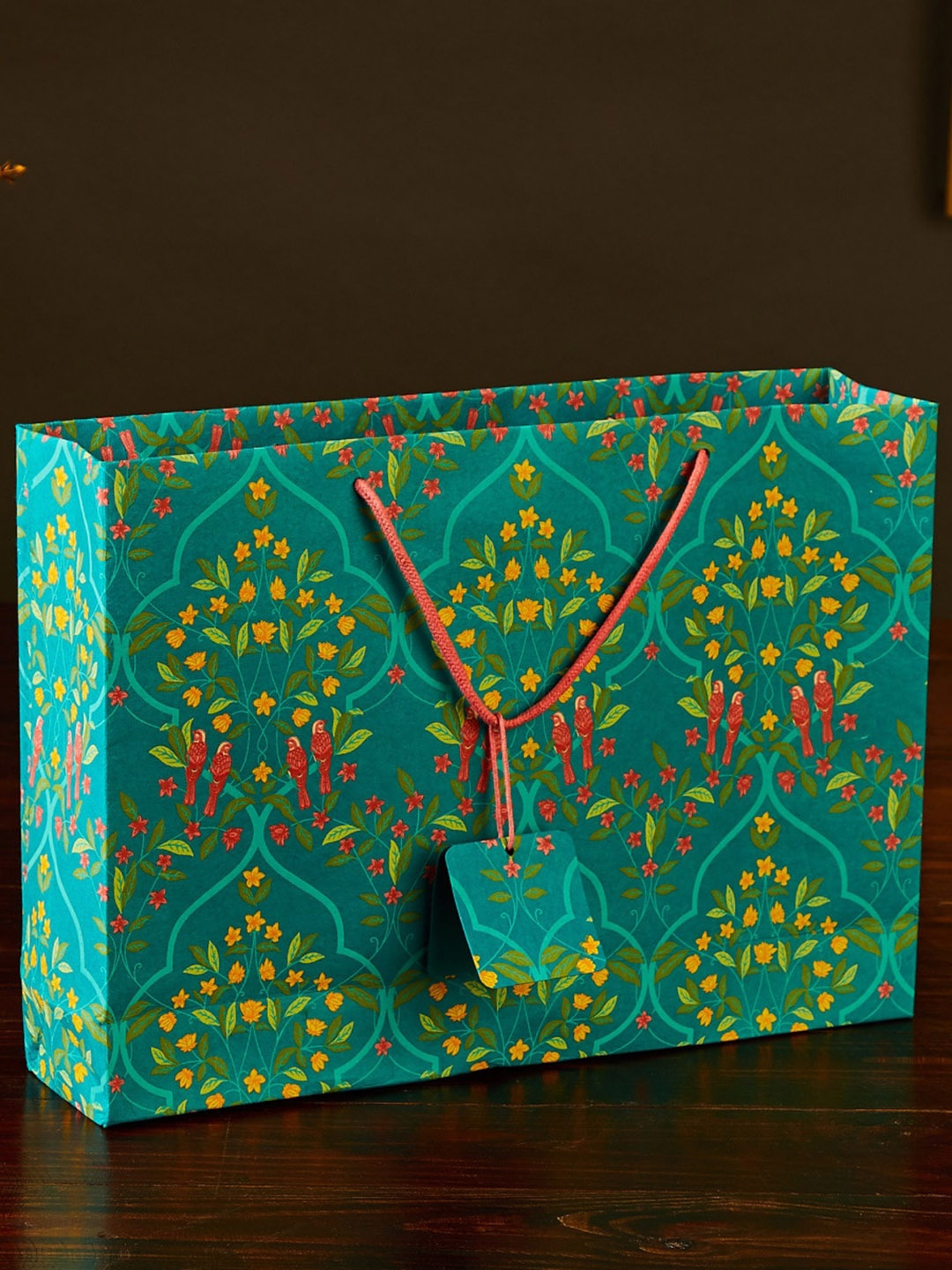 

Home Centre Teal Green & Yellow Printed Recyclable Paper Gift Bag with Tag