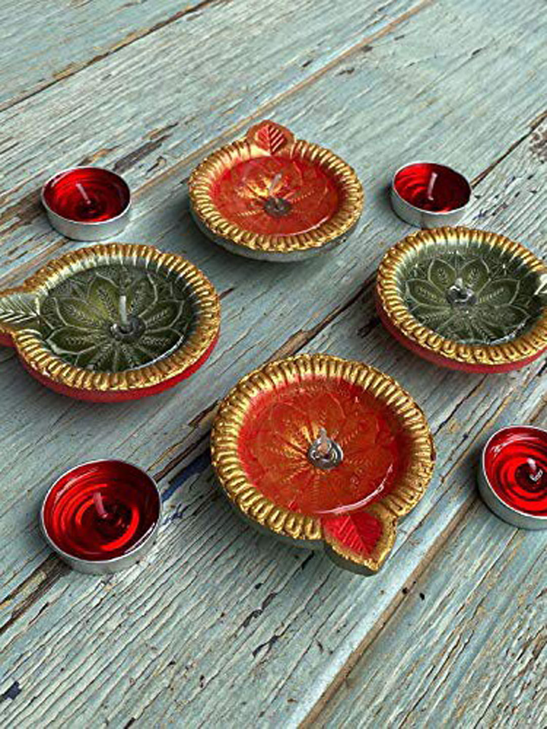 

Ariana Set of 4 Red & Gold-Toned Terracotta Diya Candles