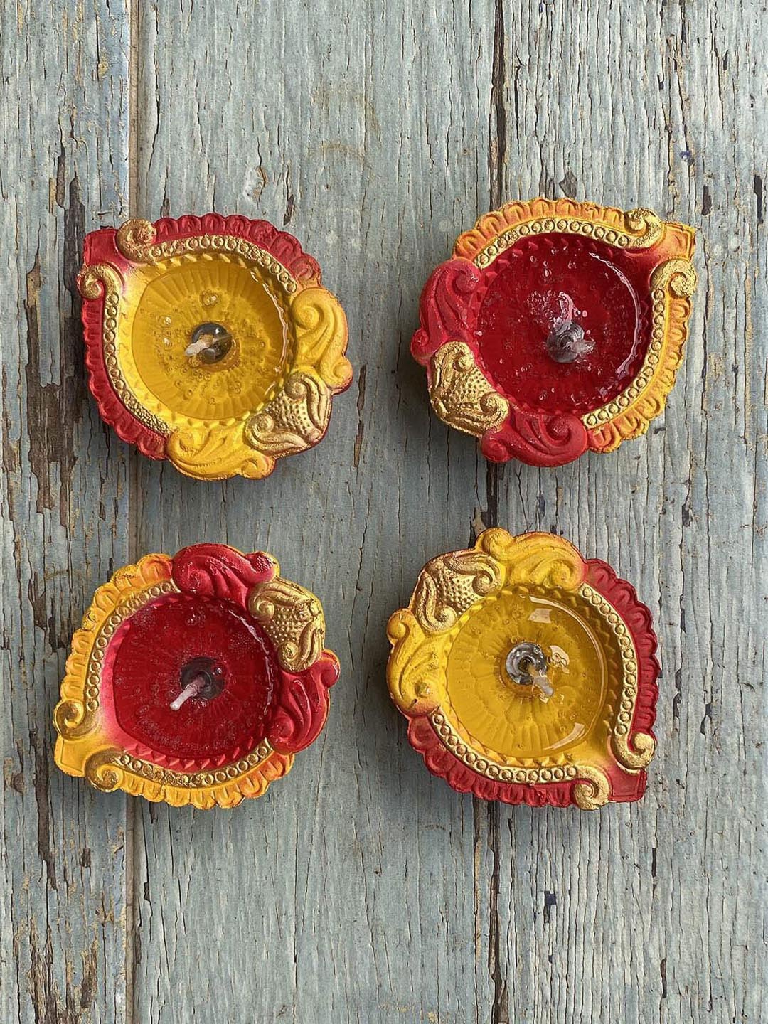 

Ariana Set of 4 Yellow & Red Terracotta Clay Diyas