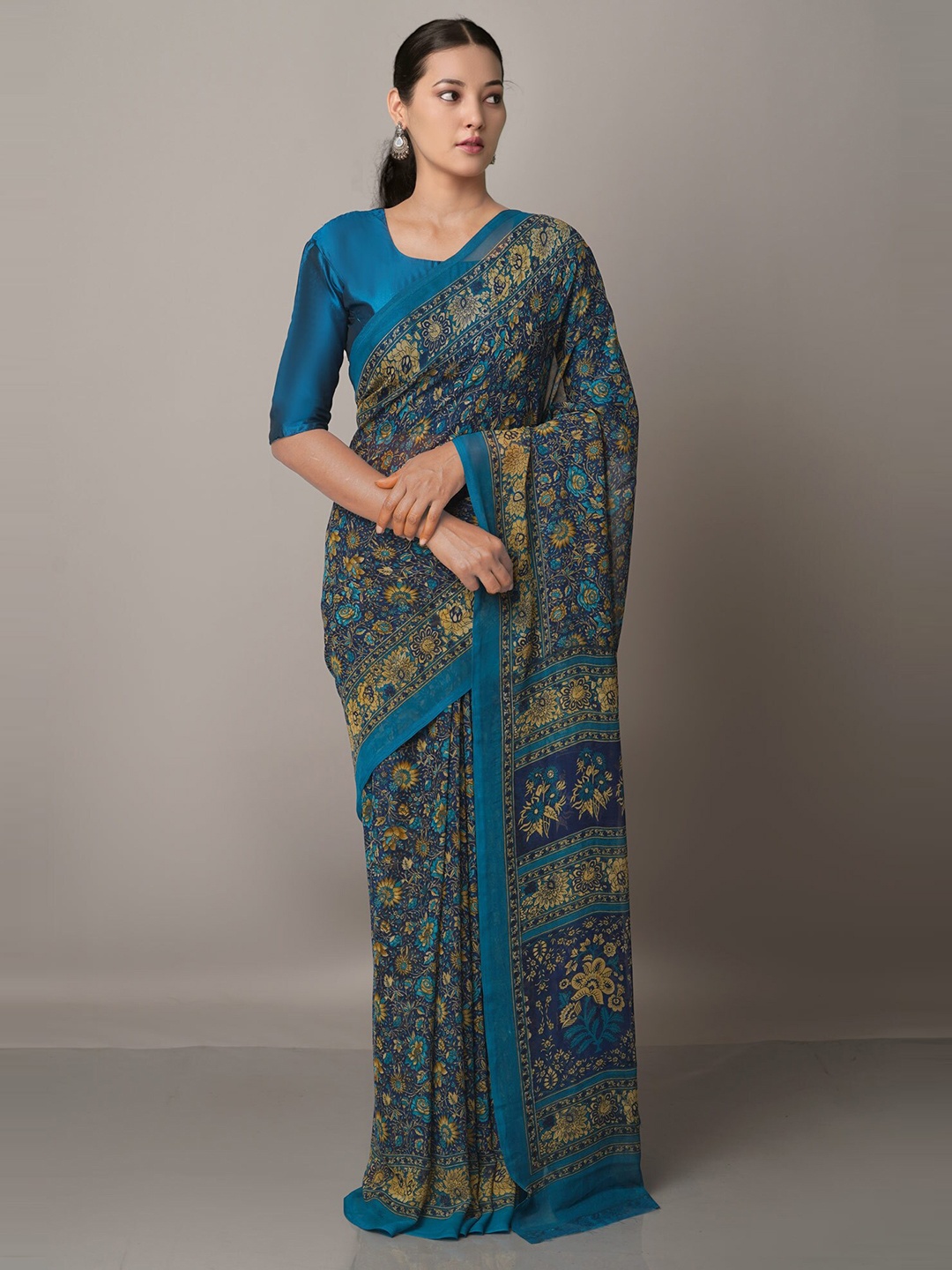 

Unnati Silks Navy Blue & Green Floral Printed Saree