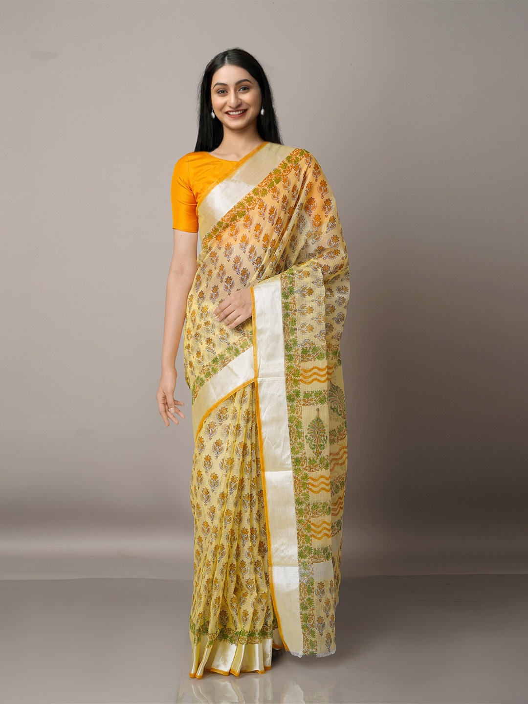 

Unnati Silks Yellow & Green Ethnic Motifs Zari Pure Cotton Kota Saree