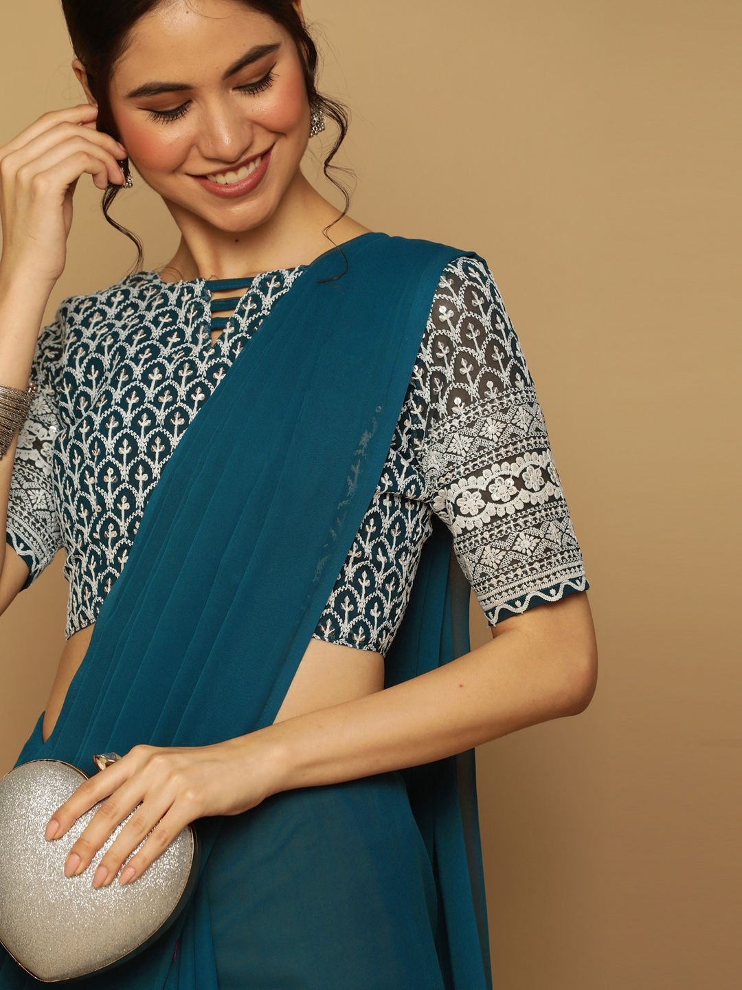 

Satrani Teal Blue Embroidered Saree