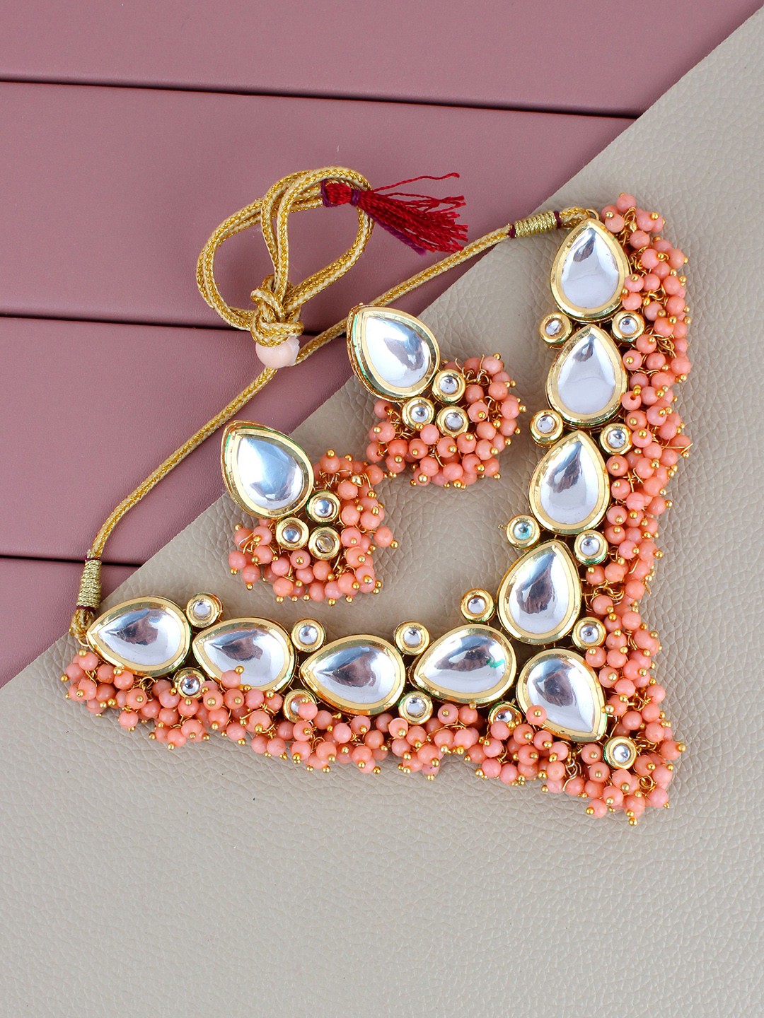 

LUCKY JEWELLERY Gold-Plated Peach-Coloured Kundan Stone-Studded Jewellery Set