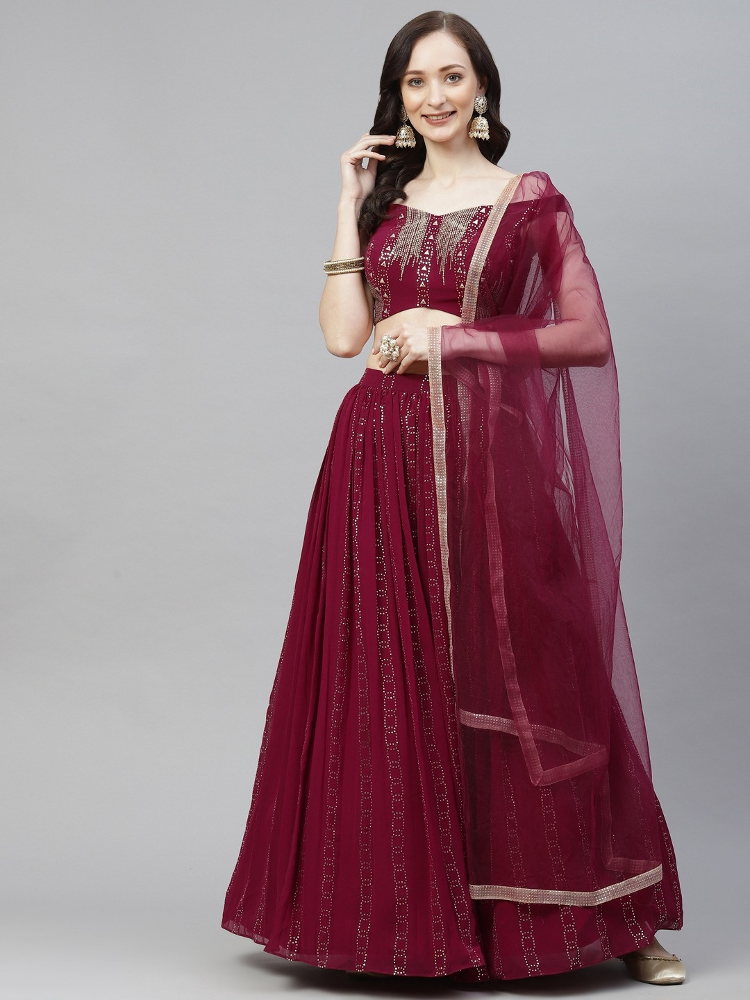 

DRESSTIVE Burgundy & Gold-Toned Embellished Mukaish Semi-Stitched Lehenga & Unstitched Blouse With Dupatta