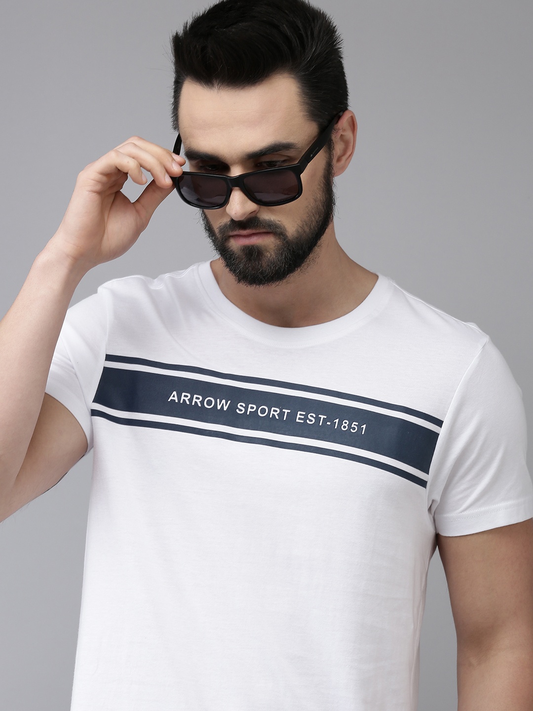 

Arrow Men White & Navy Blue Brand Logo Print & Striped Pure Cotton Knitted T-shirt