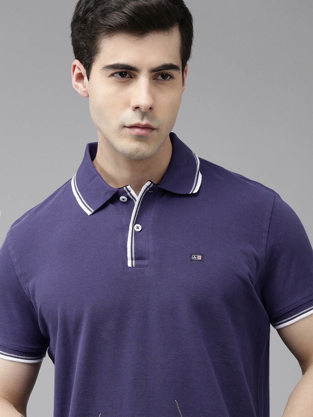 

Arrow Men Solid Polo Collar Indigo Knitted Pure Cotton T-shirt With Embroidered Detail, Blue