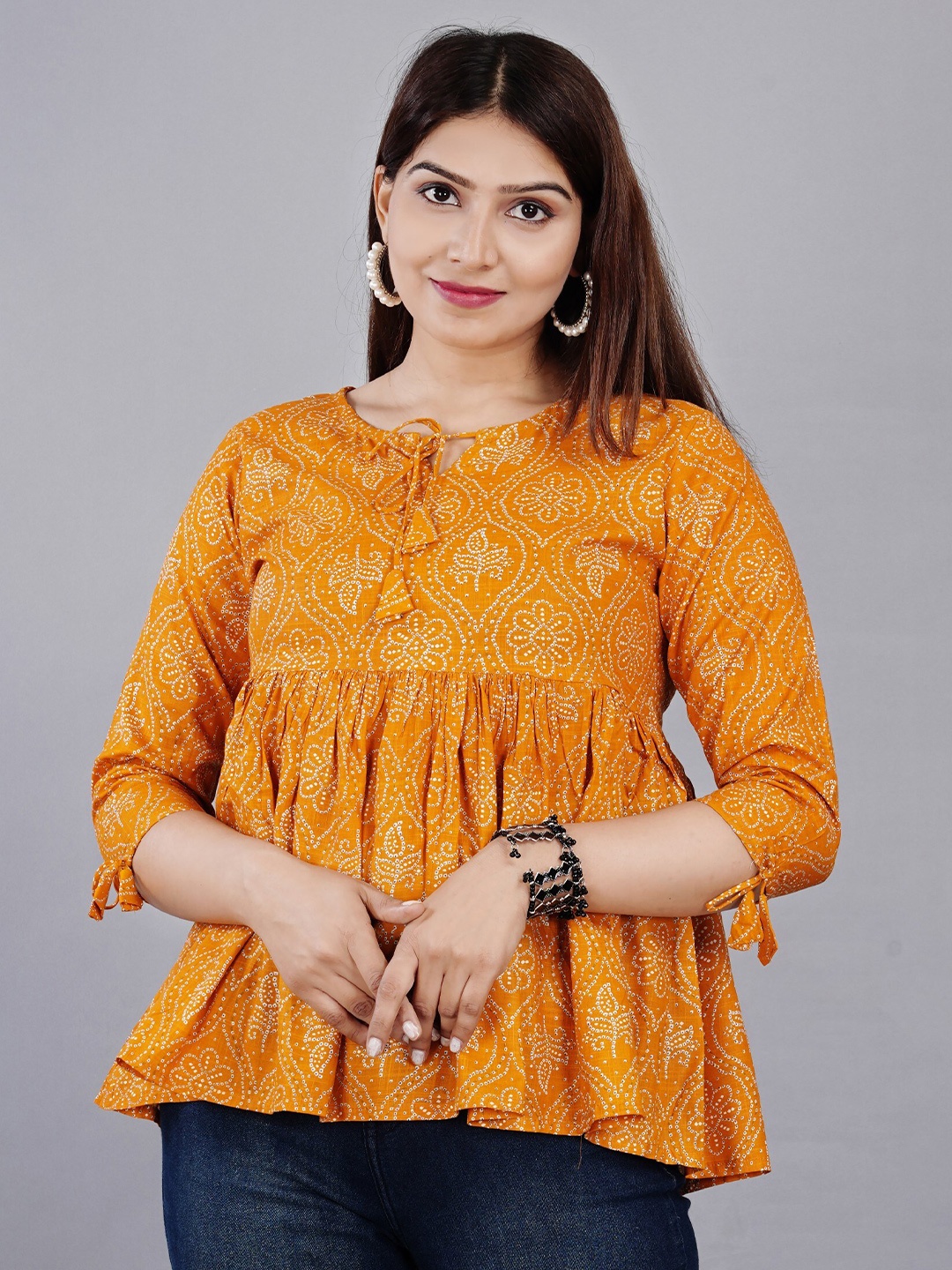 KALINI Women Mustard Yellow Print Rayon Tie-Up Neck Top
