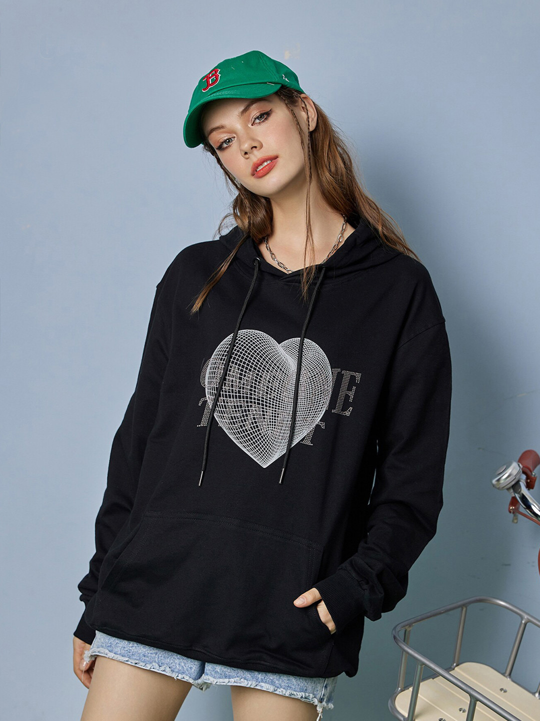 

URBANIC Women Black Printed Hooded Sweatshirt