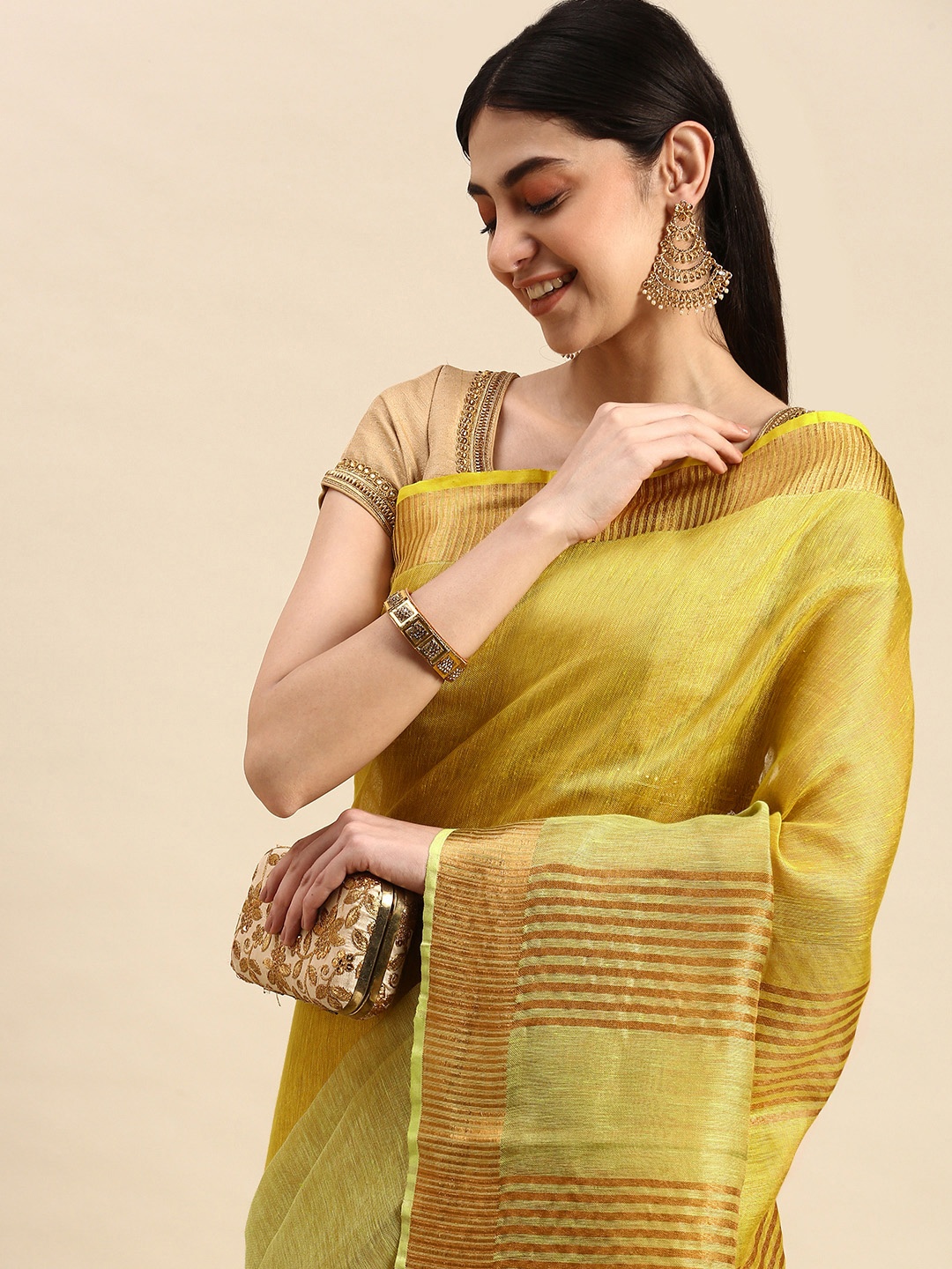 

Apaapi Threads of glory Green & Copper Ombre Zari Tissue Saree