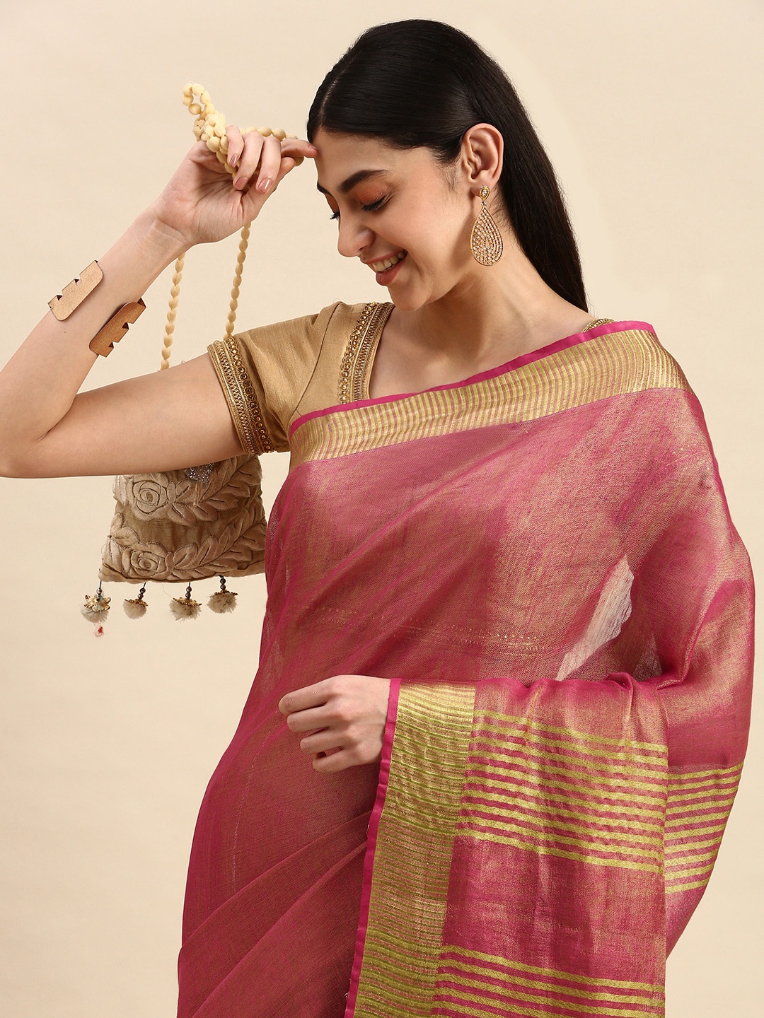 

Apaapi Threads of glory Pink & Golden Zari Tissue Saree