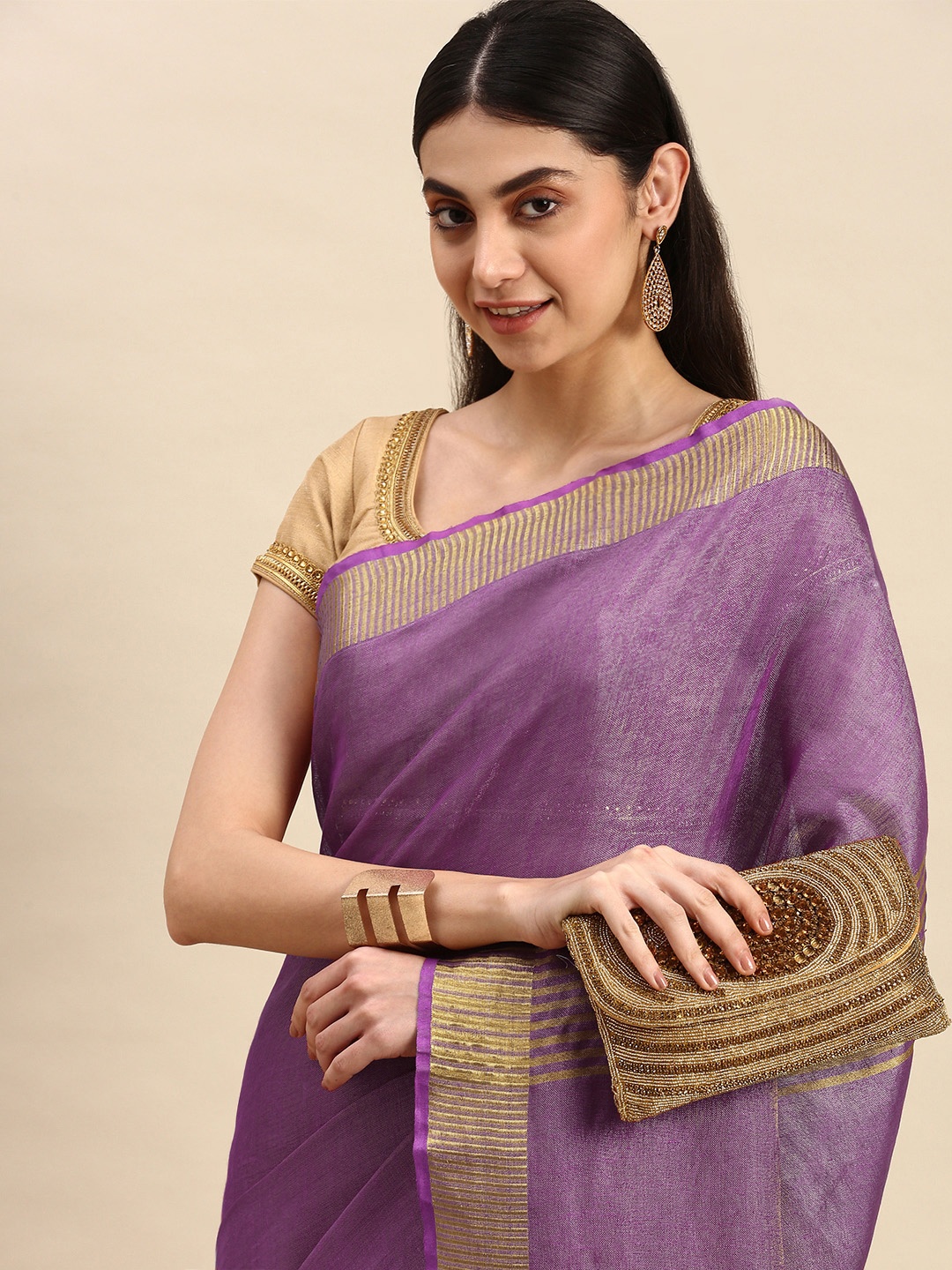 

Apaapi Threads of glory Purple & Golden Zari Tissue Saree