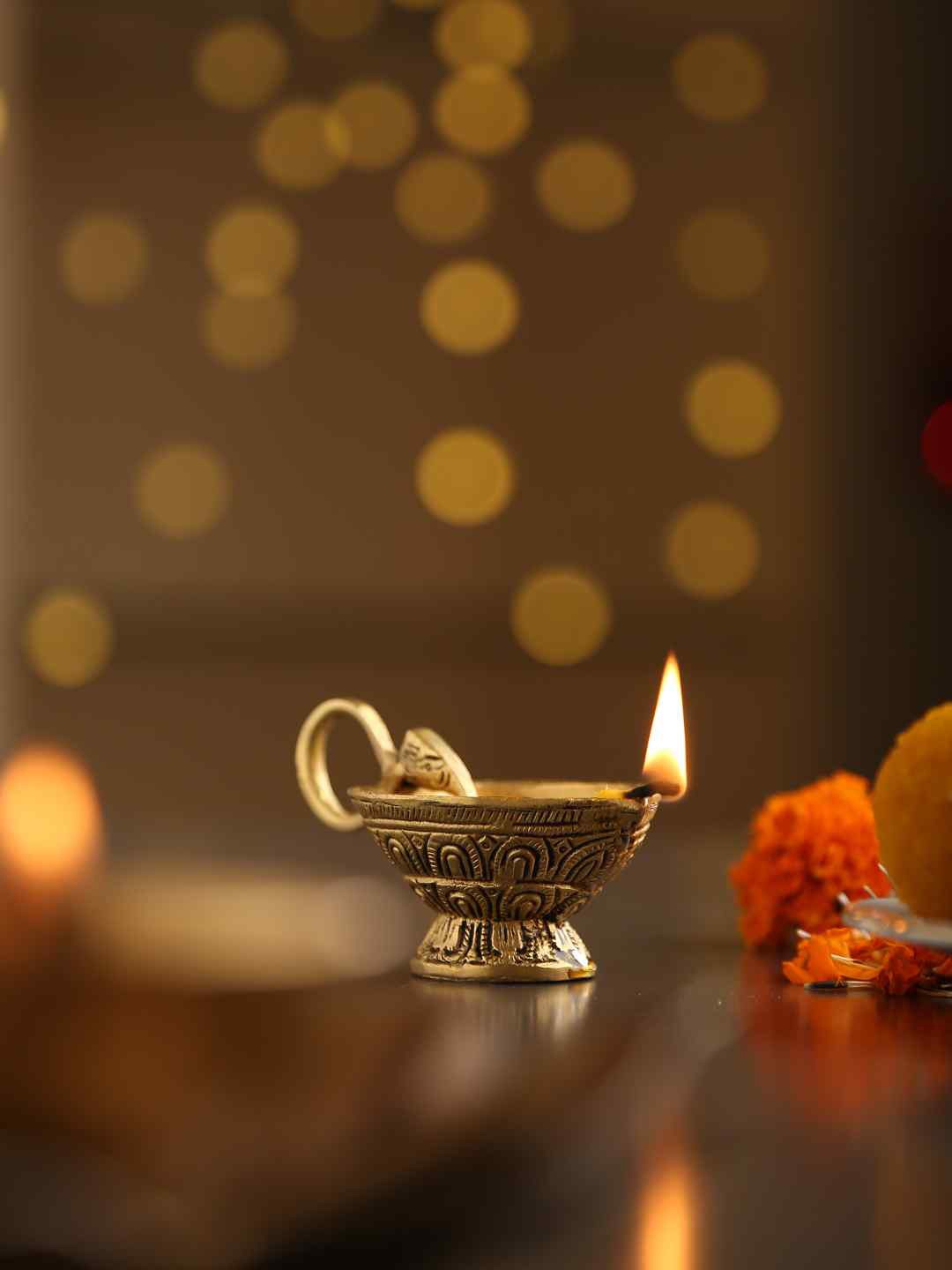 

Amoliconcepts Gold-Toned Elephant Trunk Textured Pooja Diya