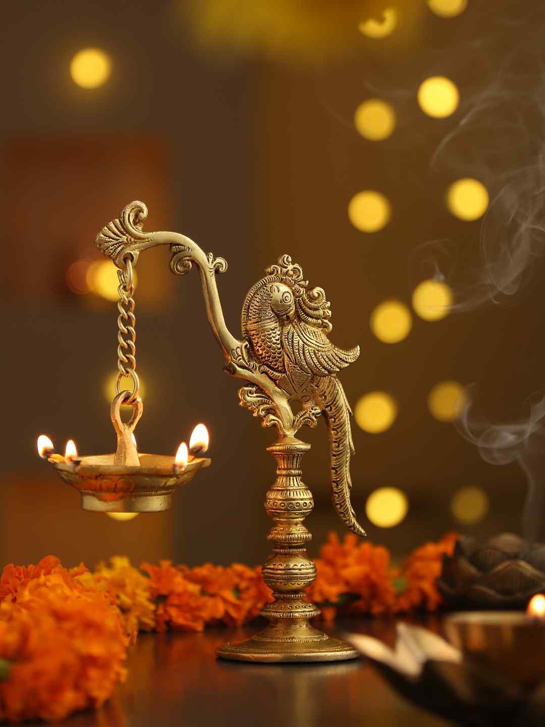 

Amoliconcepts Gold-Toned Peacock Lamp with Hanging Diya