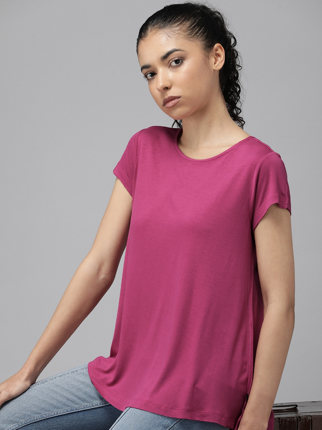 

The Roadster Lifestyle Co. Women Relaxed Fit Solid Round Neck Swing T-shirt, Magenta