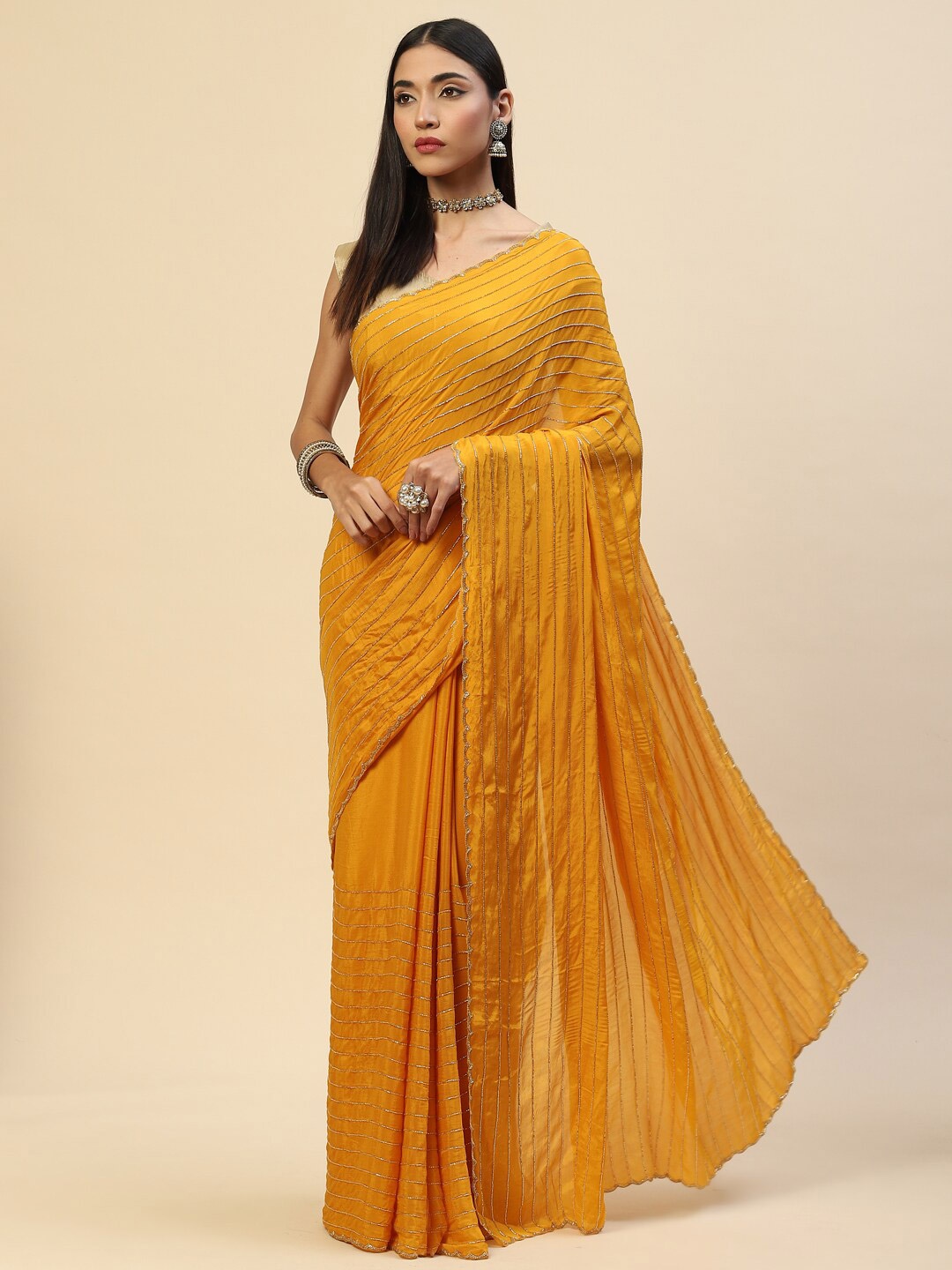 

Meena Bazaar Mustard & Silver-Toned Embellished Beads and Stones Saree