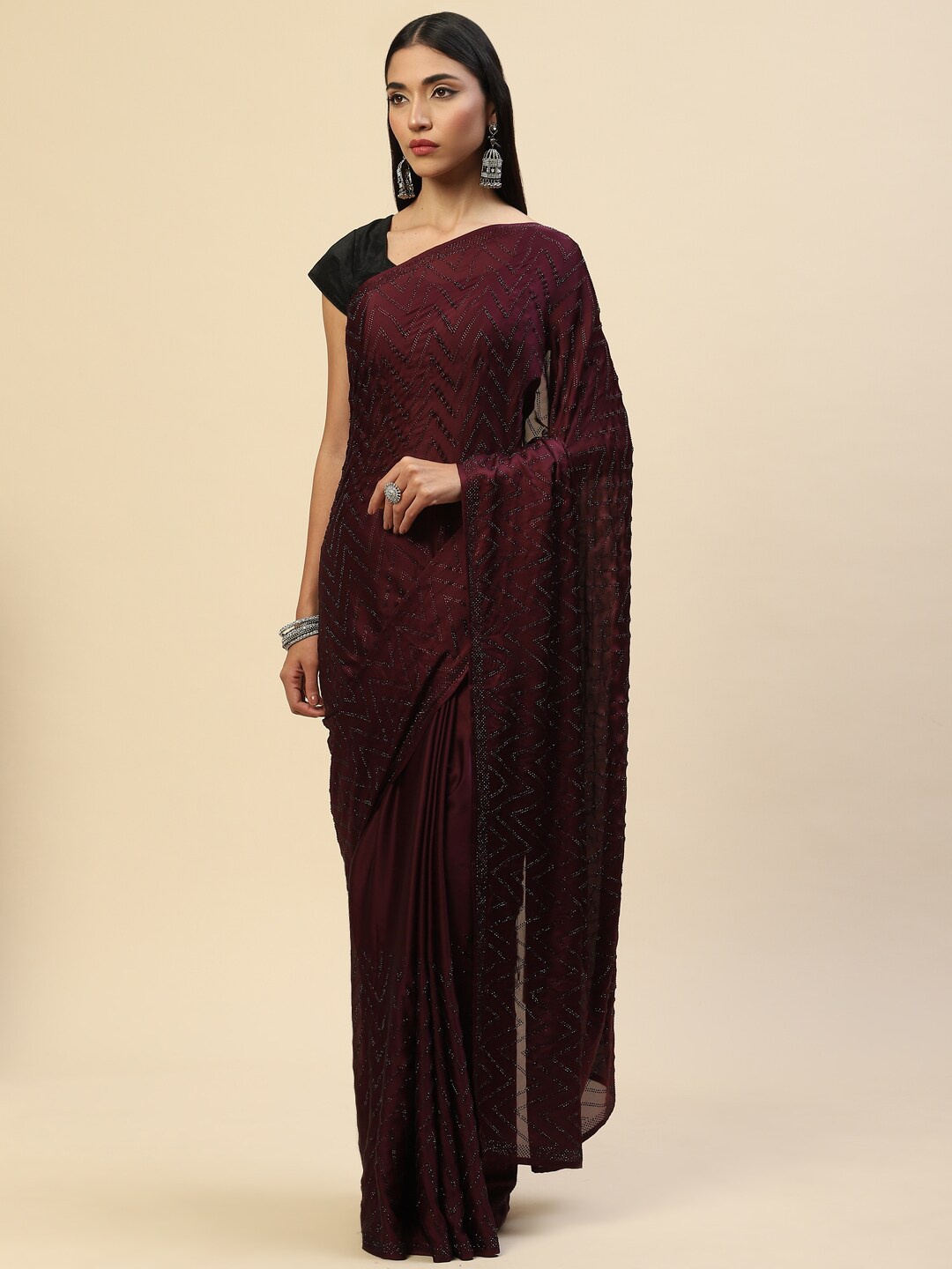 

Meena Bazaar Burgundy Embellished Beads and Stones Satin Saree