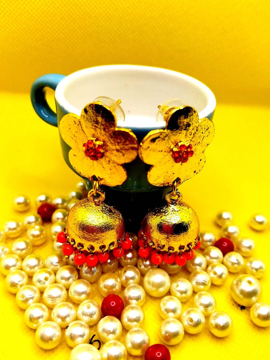 

Kshitij Jewels Orange & Gold-Toned Floral Jhumkas Earrings
