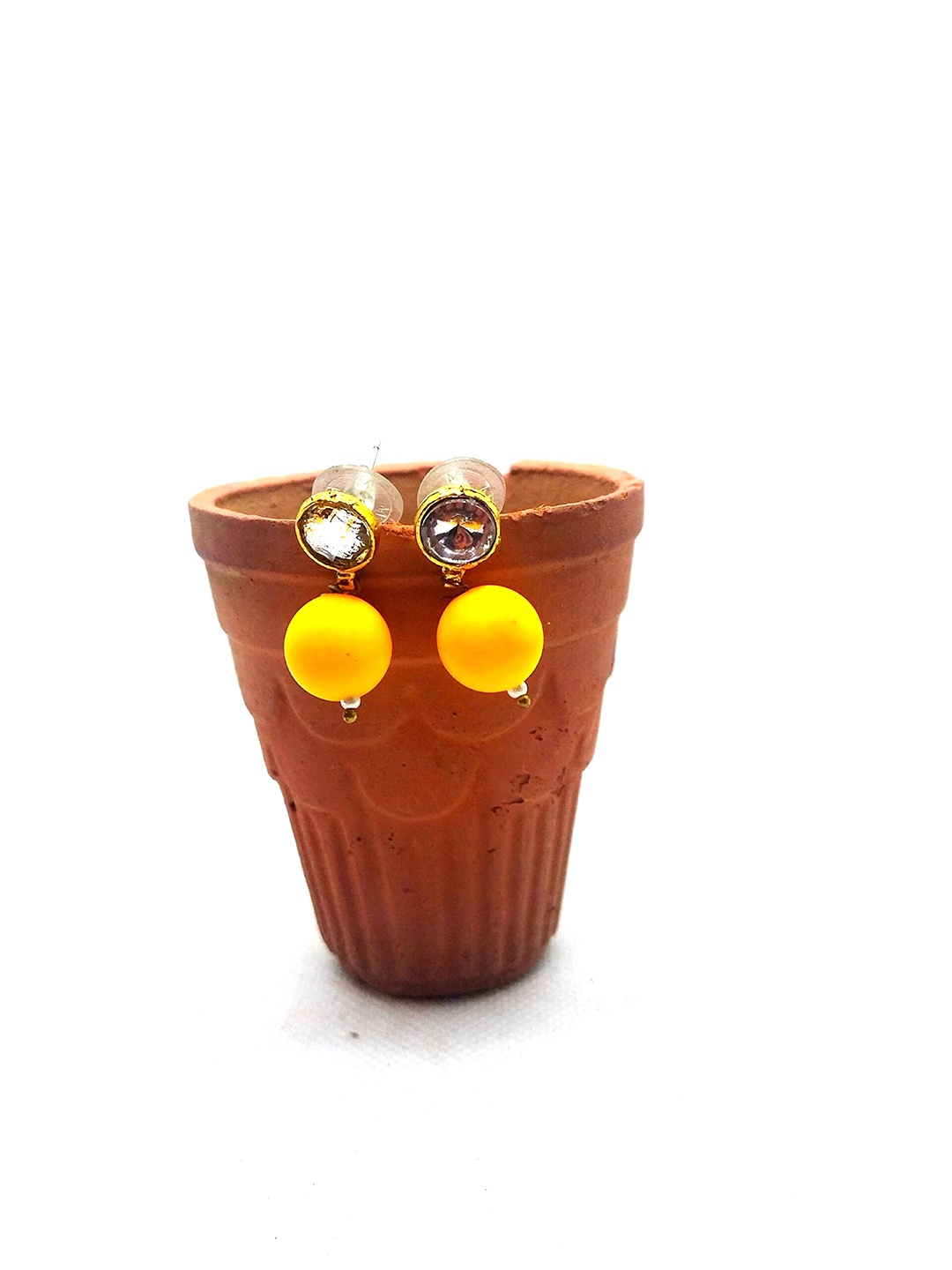 

Kshitij Jewels Women Mustard & White Teardrop Shaped Studs Earrings
