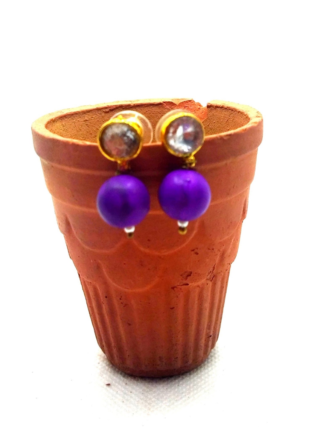 

Kshitij Jewels Purple Teardrop Shaped Drop Earrings