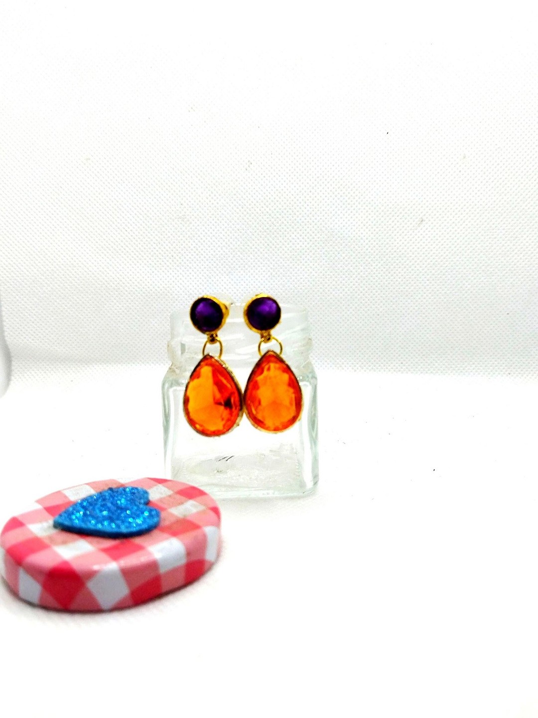 

Kshitij Jewels Women Orange Teardrop Shaped Studs Earrings