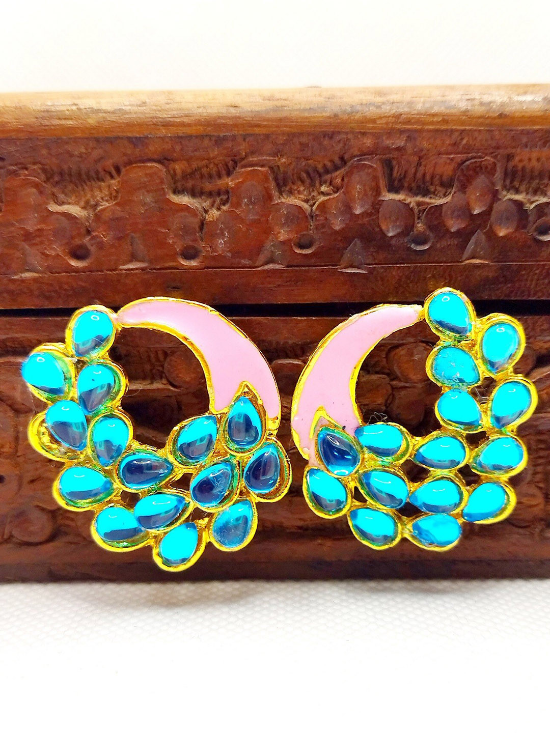 

Kshitij Jewels White And Blue Peacock Shaped Studs Earrings