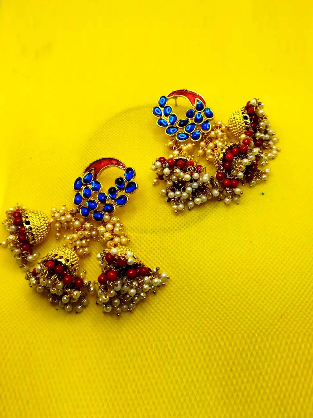 

Kshitij Jewels Red & Blue Circular Jhumkas Earrings