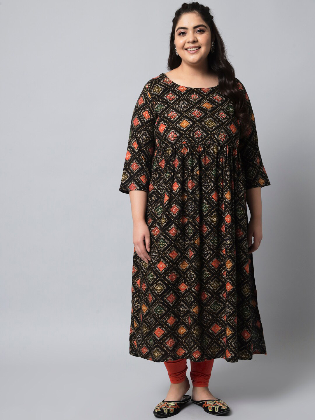 

KALINI Women Black & Orange Geometric Printed Thread Work Kurta