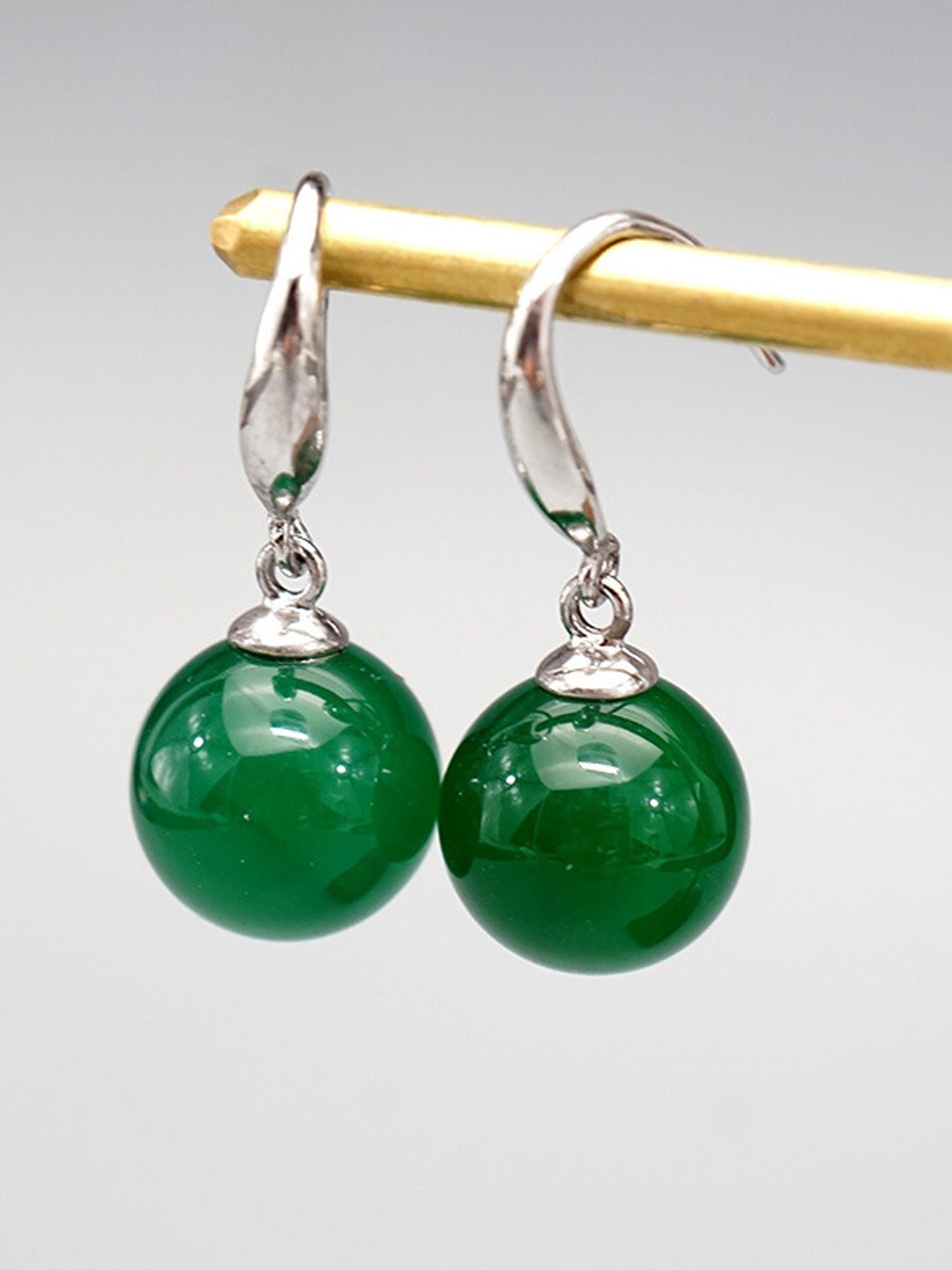 

Young & Forever Women Green Silver-Plated Spherical Drop Earrings
