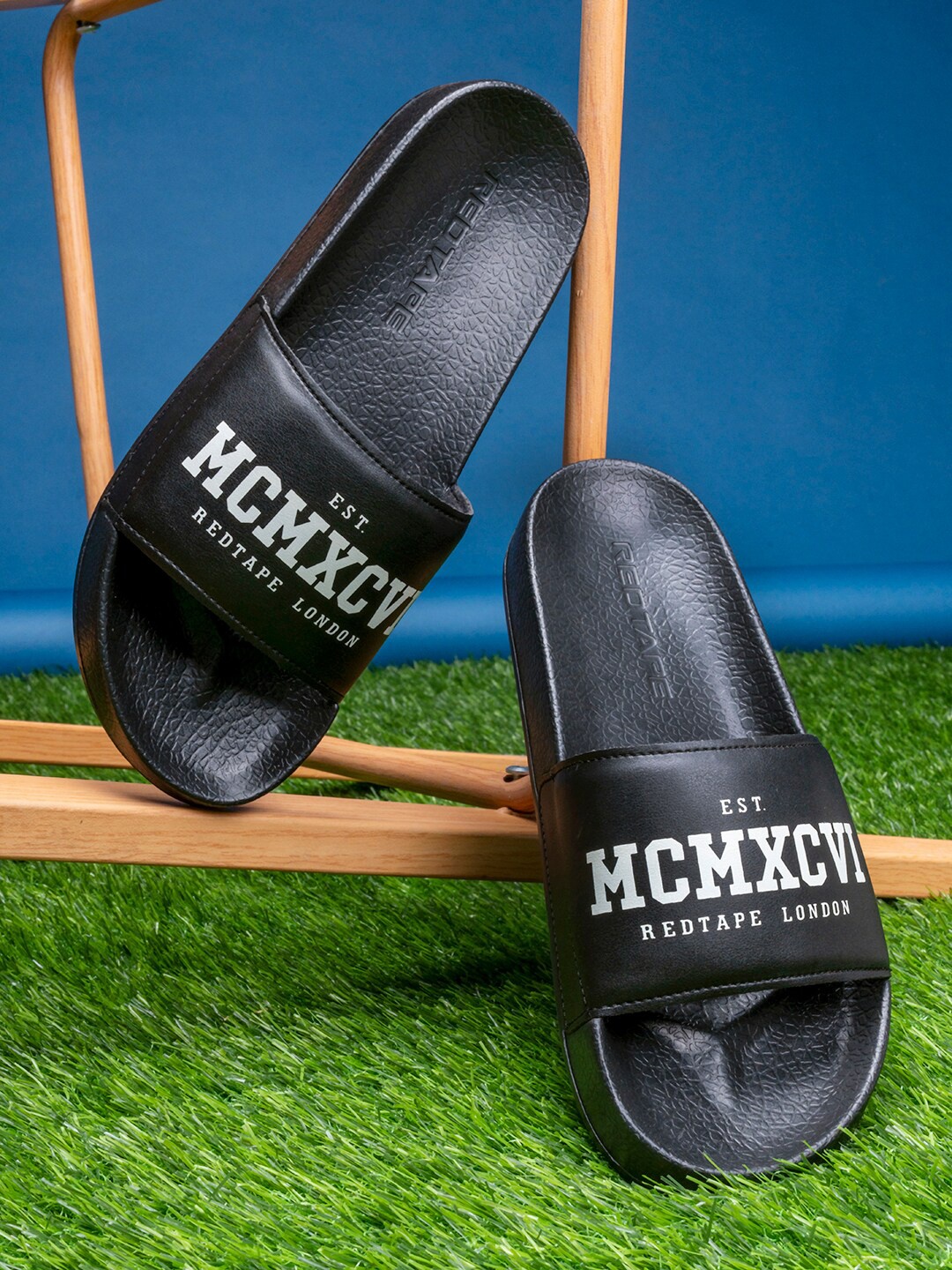 

Red Tape Men Black & White Printed Rubber Sliders