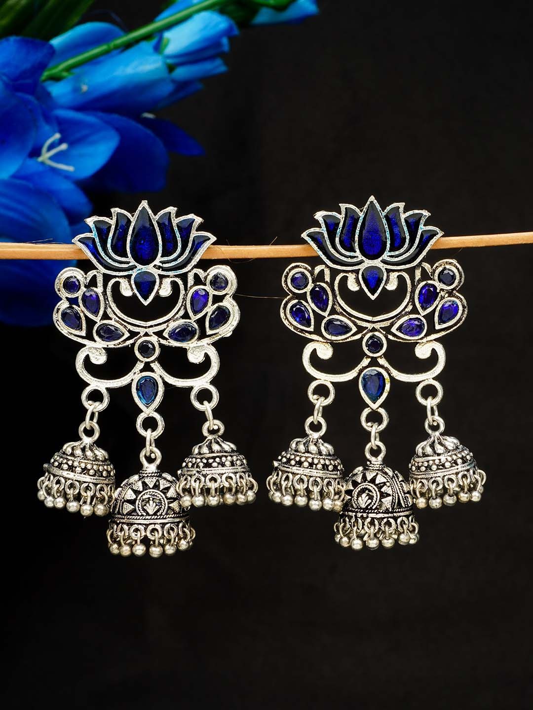 

Urmika Blue & Silver Plated Oxidised Diamond Shaped Jhumkas Earrings