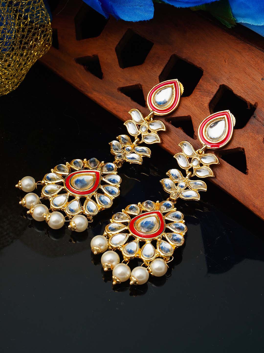 

Urmika Red Teardrop Shaped Drop Earrings