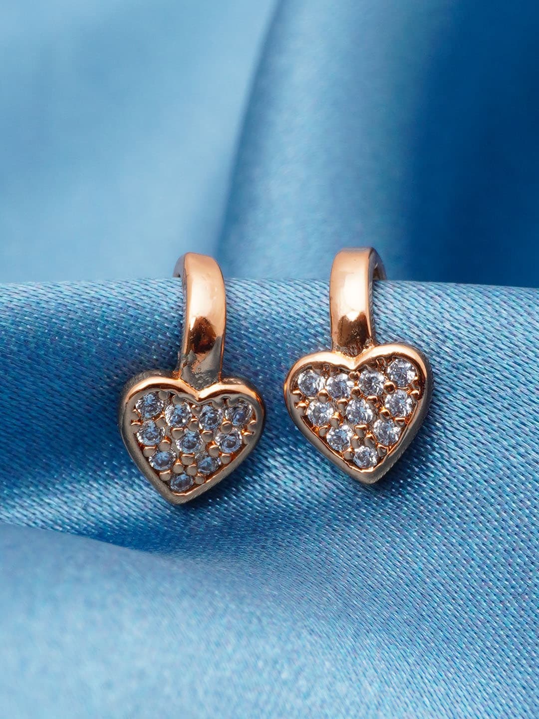 

Urmika Gold Plated & White Heart Shaped Ear Cuff Earrings