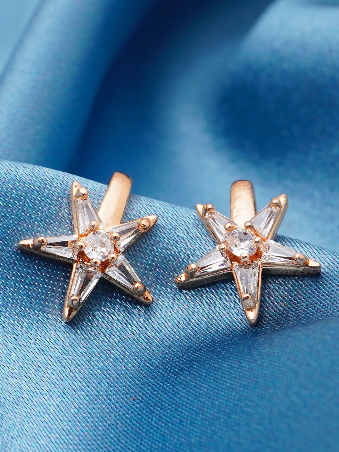 

Urmika Women Gold-Toned & White Star Shaped Studs Earrings