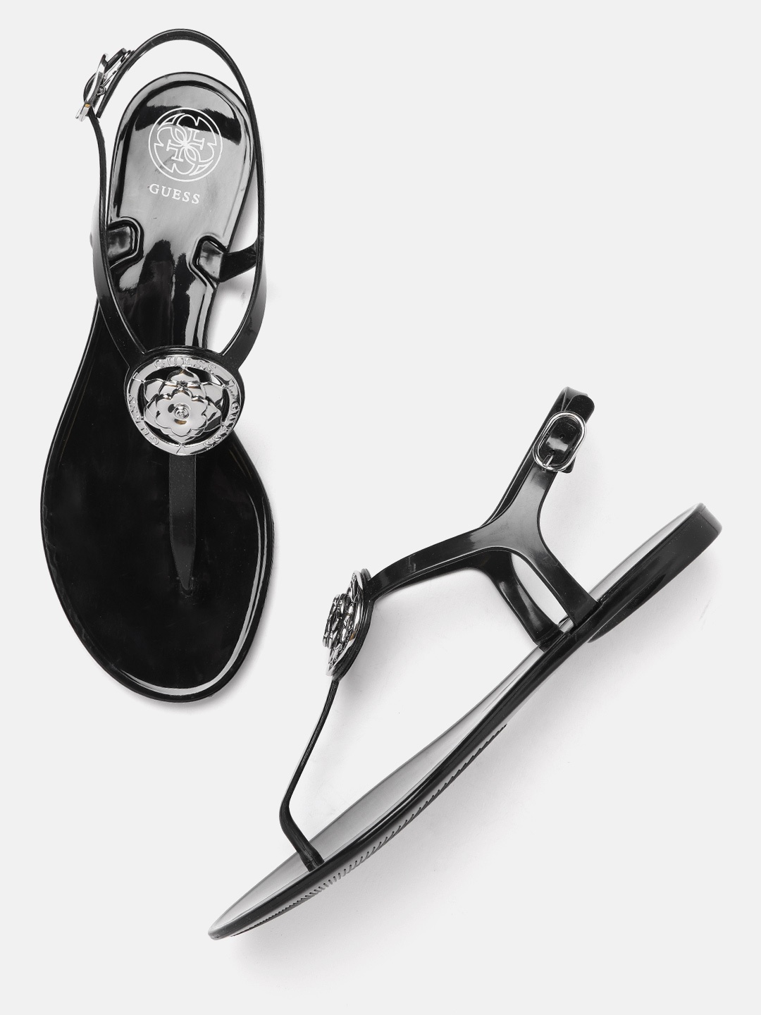 

GUESS Women Black & Silver-Toned Brand Logo Detail T-Strap Flats