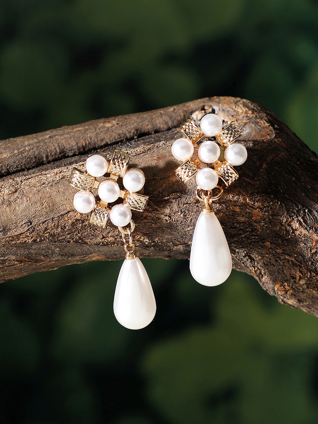 

SOHI Women Gold-Toned & White Contemporary Drop Earrings