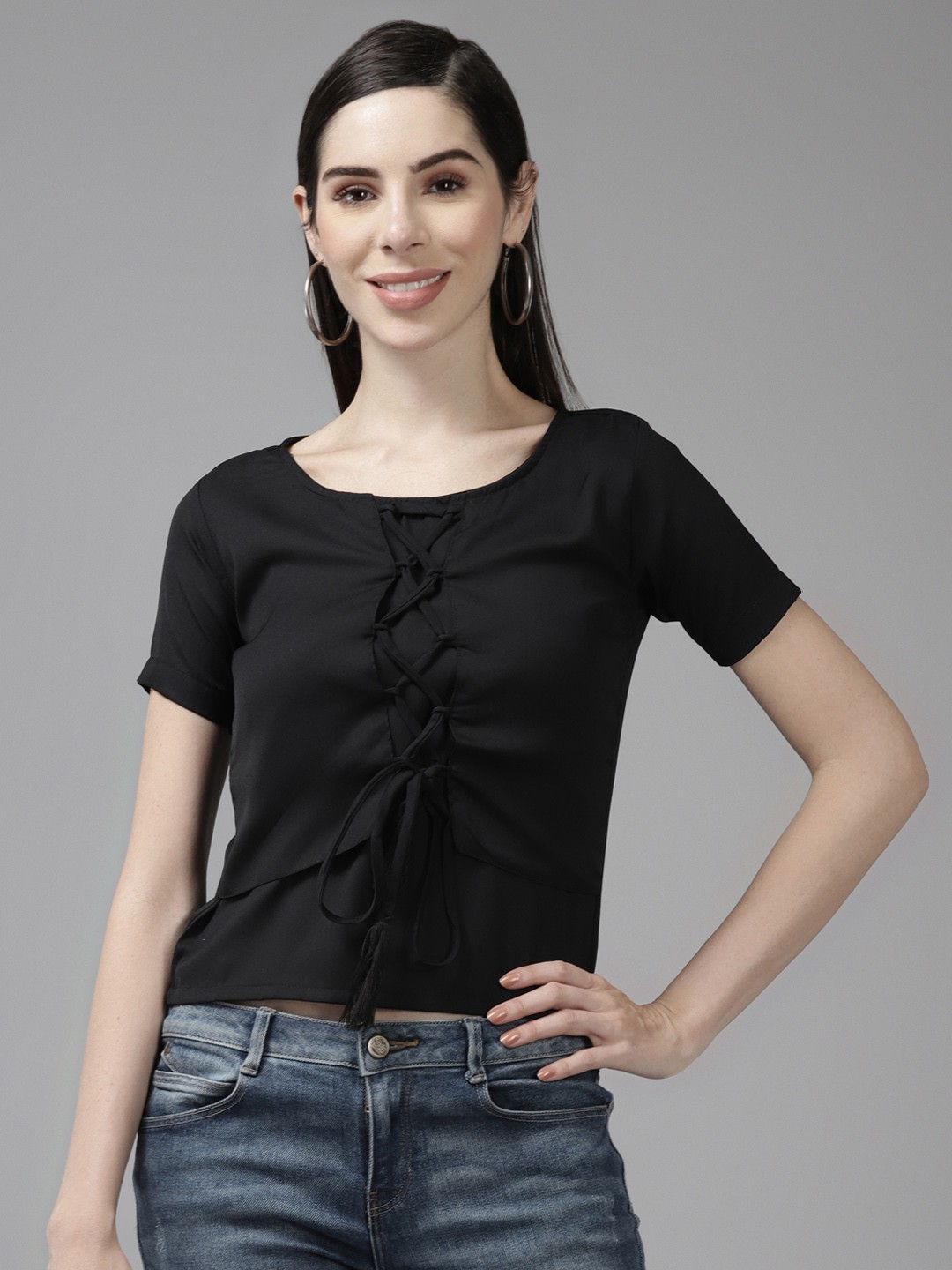 

Aarika Women Black Solid Round Neck Top