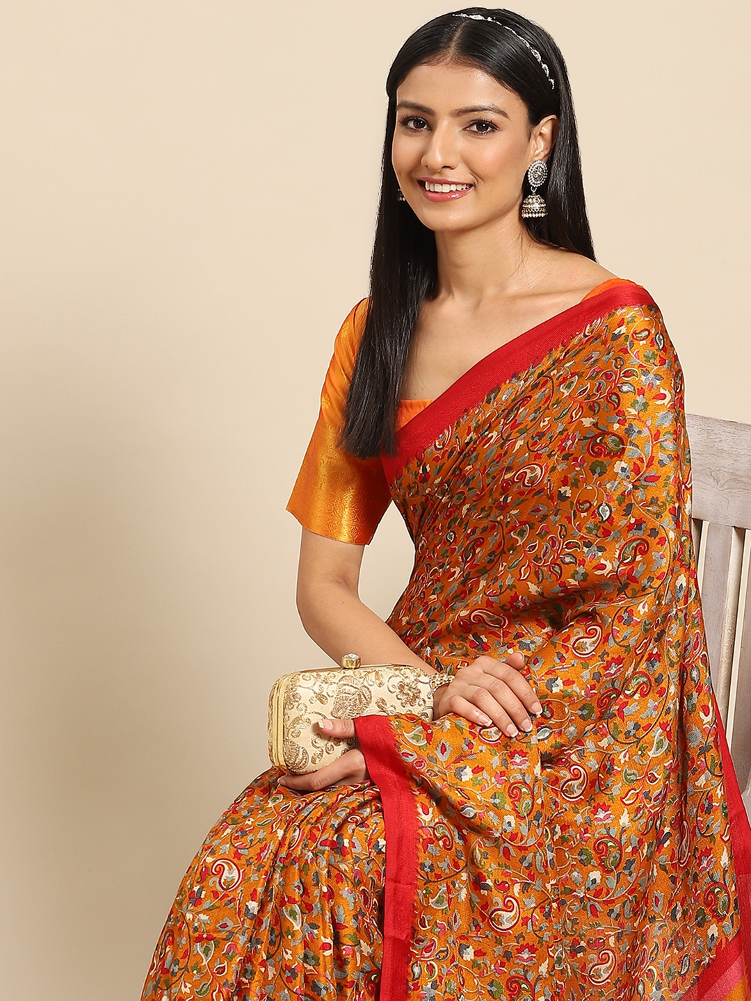 

Nimayaa Women Mustard & Red Ethnic Motifs Saree