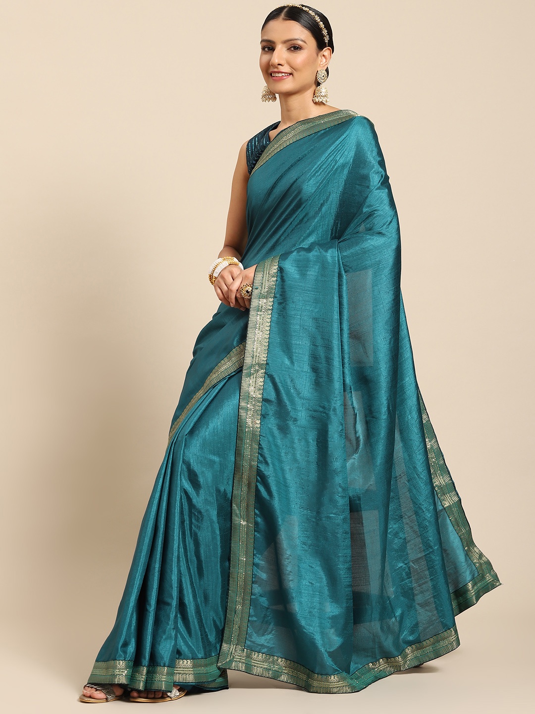 

Nimayaa Women Teal Blue Solid Saree