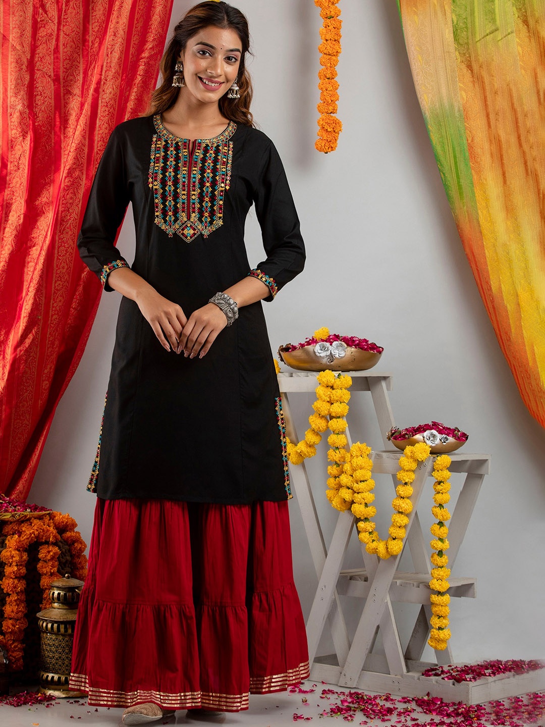 

SUTI Women Black Embroidered Mirror Work Kurti with Skirt