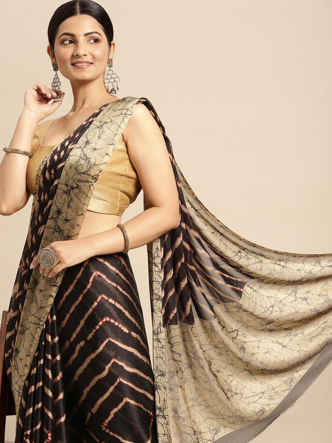 

RACHNA Black & Off White Poly Chiffon Striped Saree