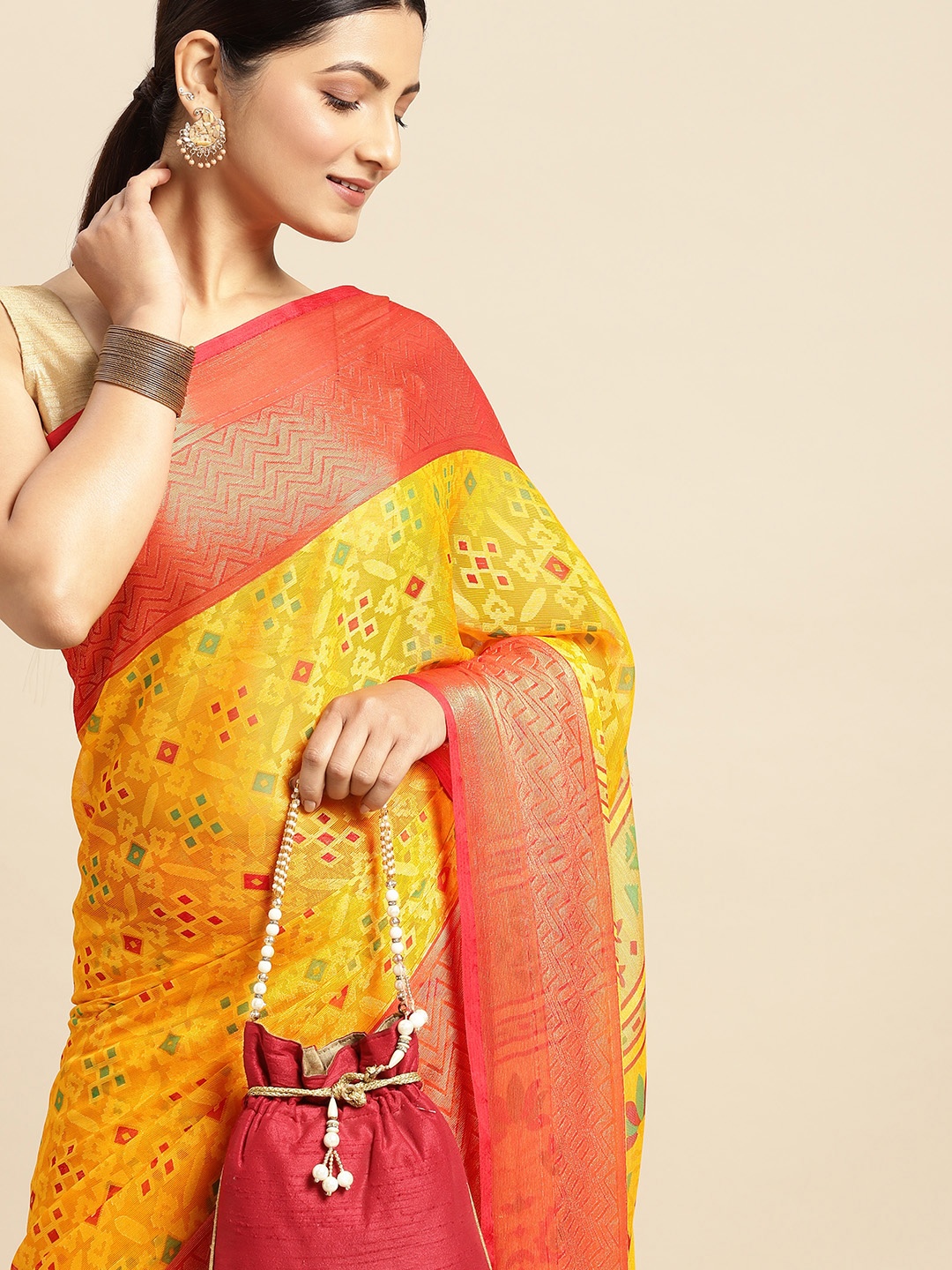 

RACHNA Yellow Ethnic Motifs Printed Brasso Saree