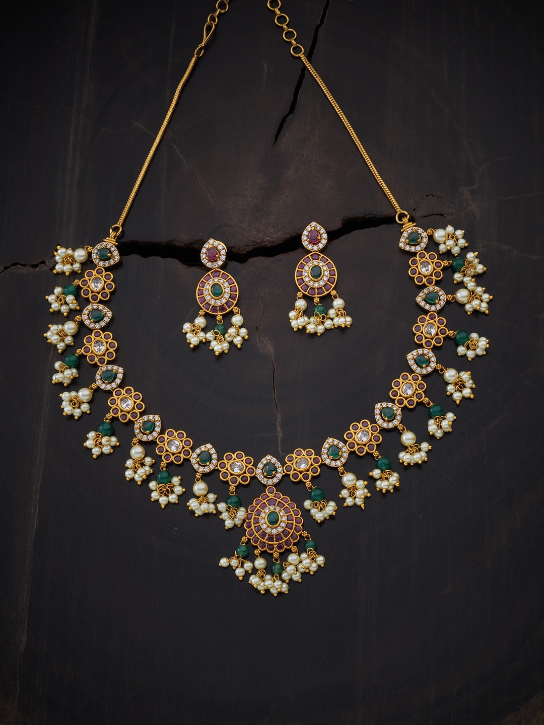 

Kushal's Fashion Jewellery Gold-Toned & White Stone Studded & Beaded Jewellery Set
