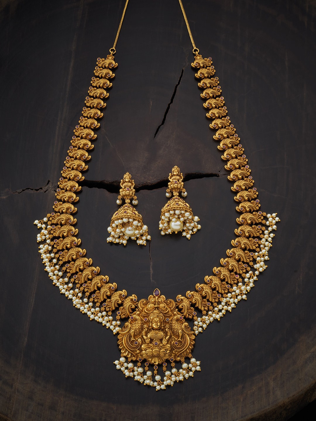 

Kushal's Fashion Jewellery Gold-Toned & White Stone-Studded Antique Jewellery Set
