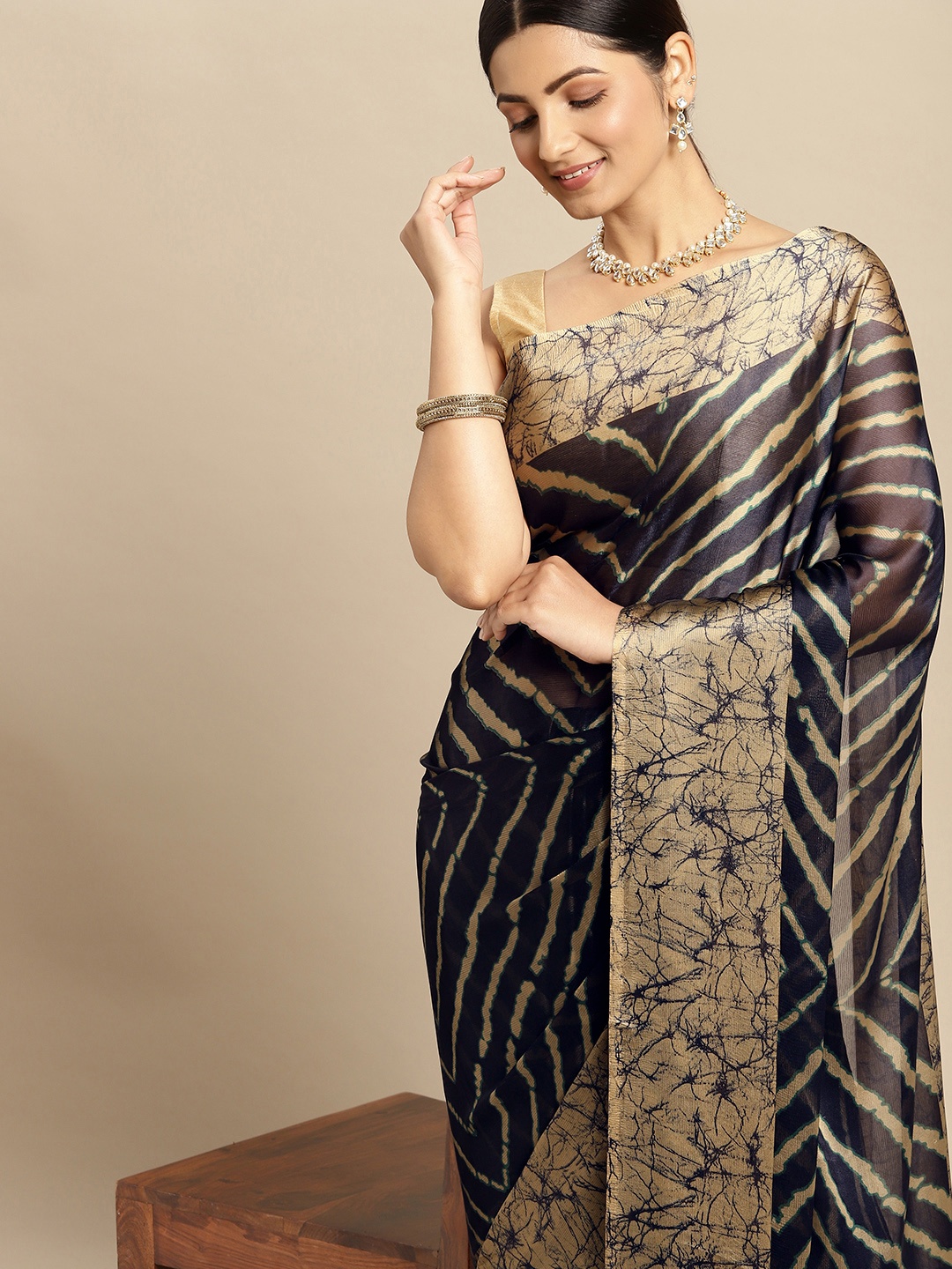 

RACHNA Navy Blue & Beige Striped Brasso Saree