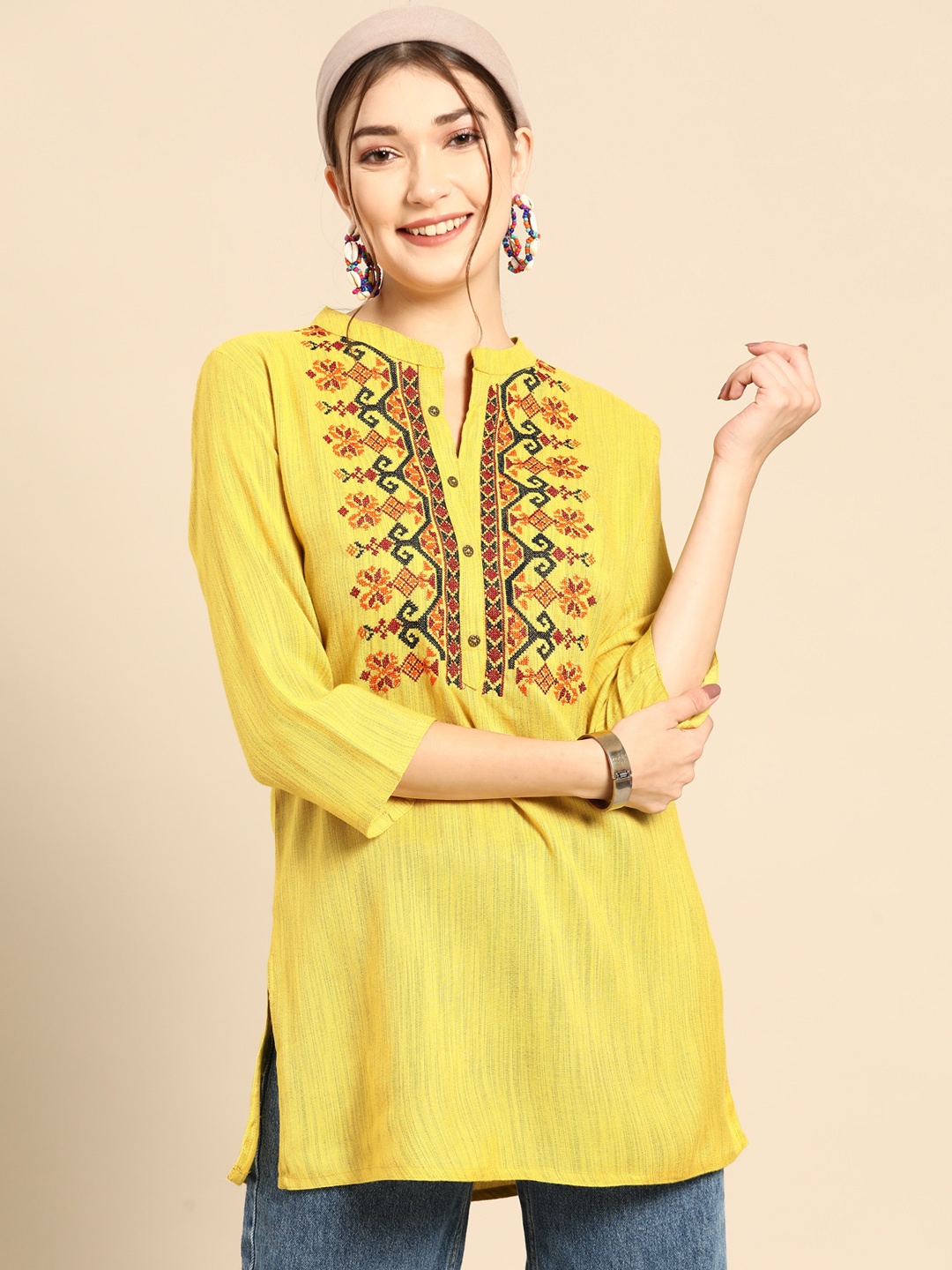 

Sangria Yellow & Orange Ethnic Motifs Embroidered Thread Work Thread Work Kurti