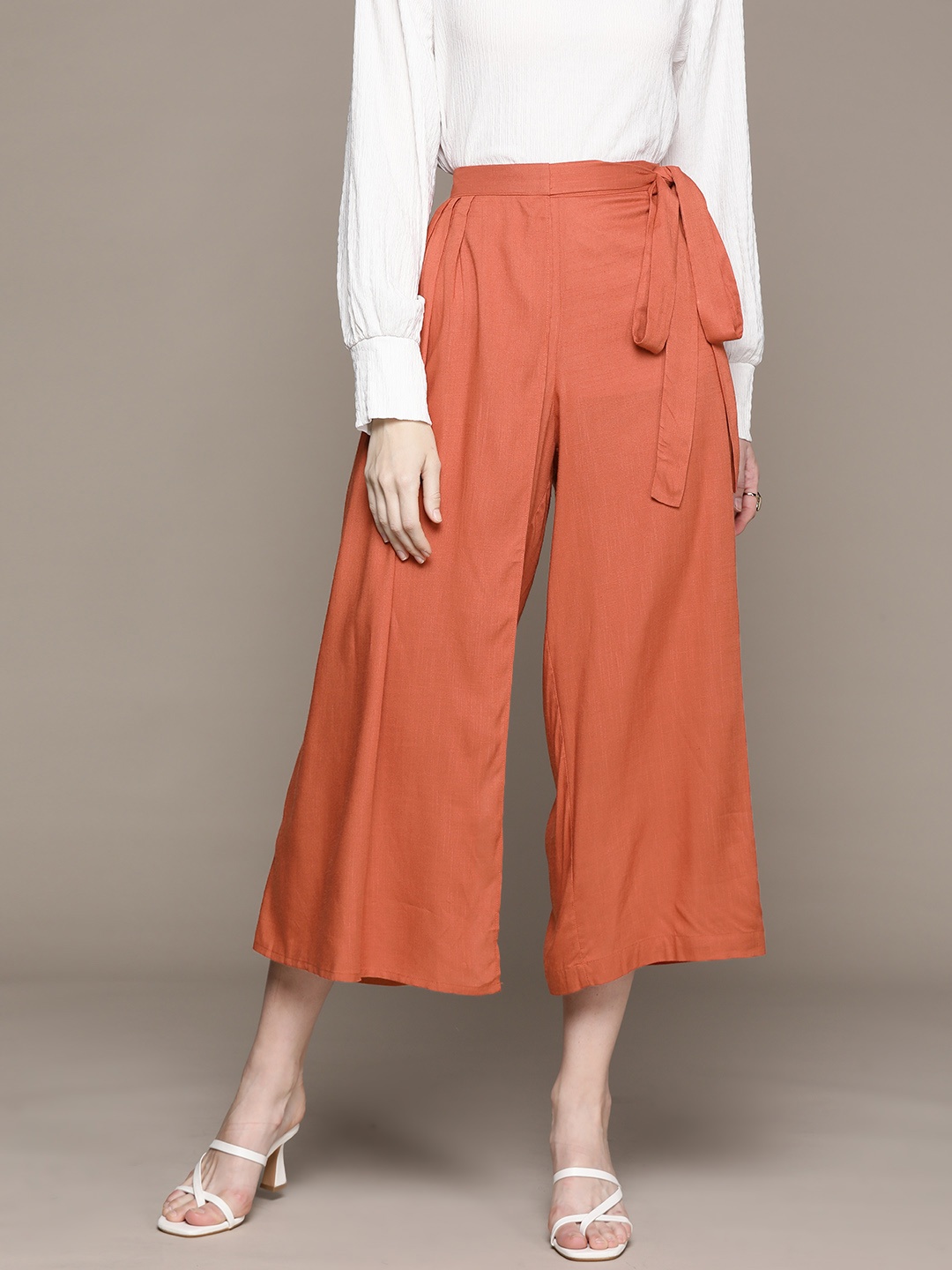 

aarke Ritu Kumar Women Tie-Up Detail Flared Trousers, Rust